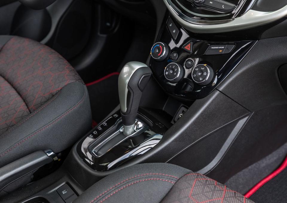 <p>Small buttons on one side of the shifter provide manual gear selection when necessary, but it's not a feature you'll use just for kicks.</p>