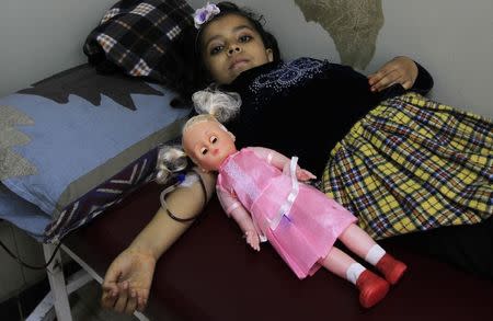 A girl suffering from Thalassaemia undergoes a blood transfusion process at Pakistan Institute of Medical Sciences (PIMS) in Islamabad December 5, 2014. REUTERS/Faisl Mahmood