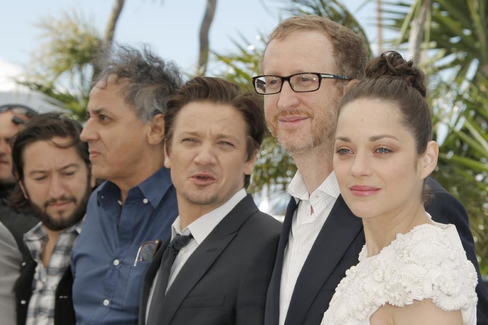 From left, producer Greg Shapiro, director Of photography Darius Khondji, actor Jeremy Renner, director James Gray and actress Marion Cotillard pose for photographers during a photo call for the film The Immigrant at the 66th international film festival, in Cannes, southern France, Friday, May 24, 2013. (AP Photo/Francois Mori)