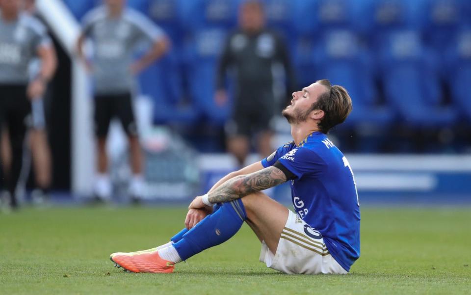 James Maddison sits disconsolate on the ground - GETTY IMAGES