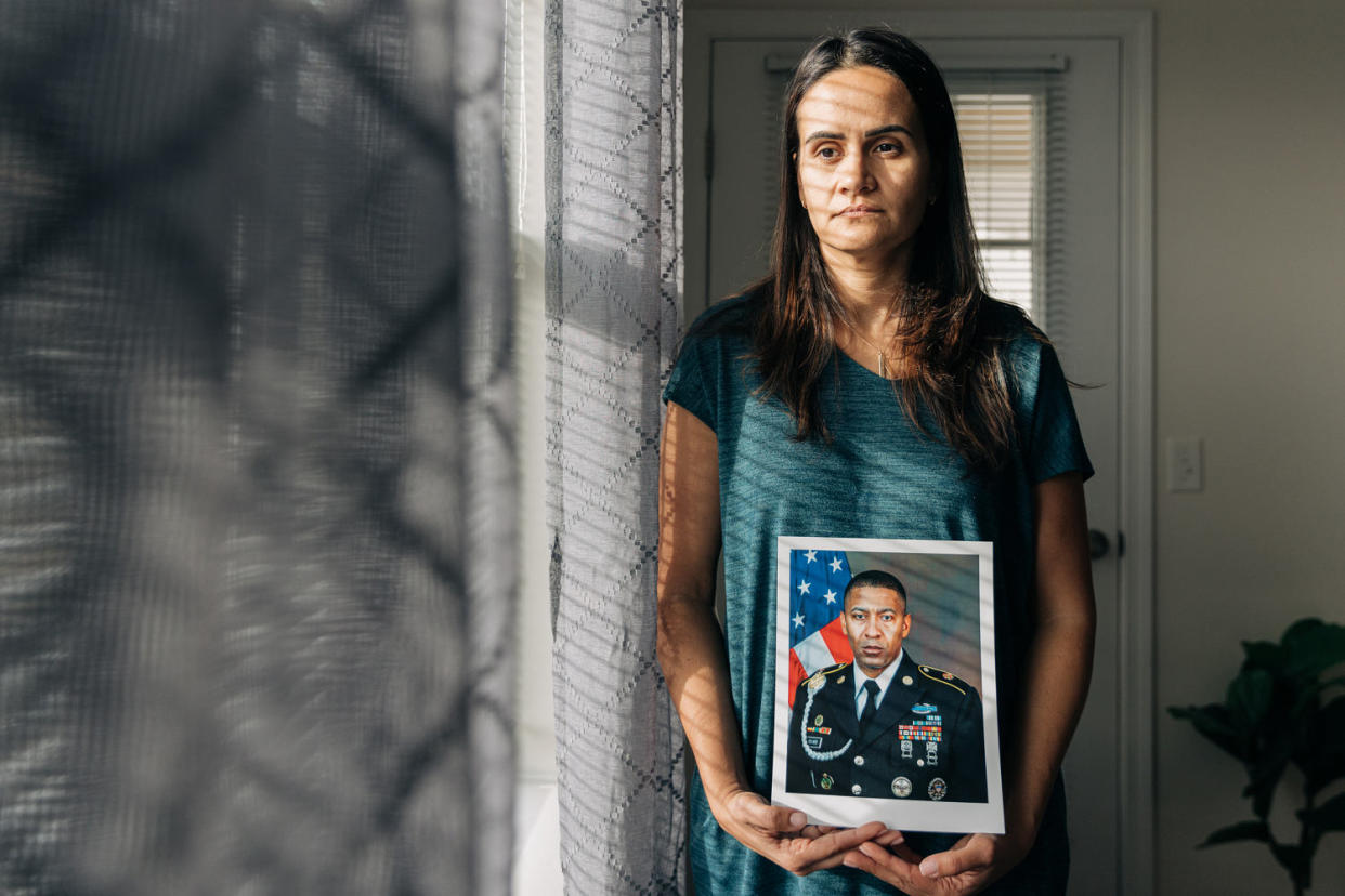 Natasha Cruz-Bevard holds a photo of her husband Rodney C. Bevard. (Jeenah Moon for The Washington Post via Getty Images)