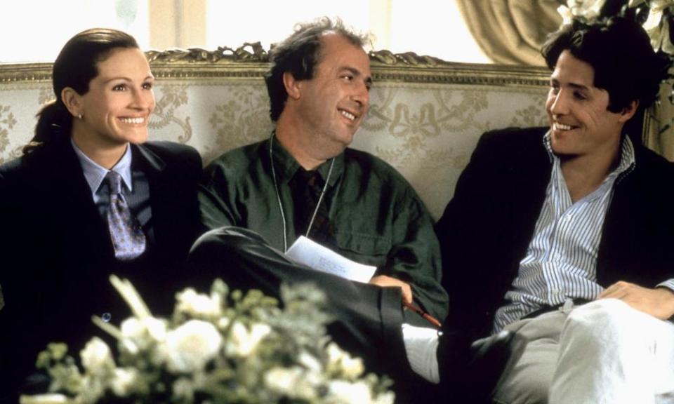 Roger Michell, centre, with Hugh Grant and Julia Roberts on the set of Notting Hill, 1999.