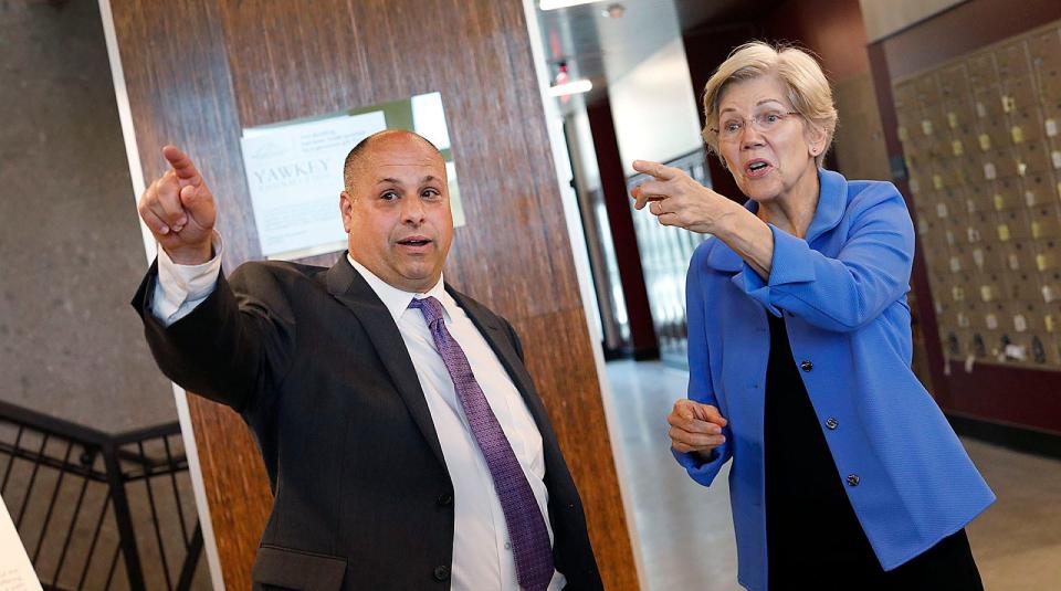 Father Bill's CEO John Yazwinski and U.S. Sen. Elizabeth Warren talk about the Manet Health Clinic to be located at the new Yawkey Housing Resource Center in Quincy. Warren visited the center on Wednesday, Aug. 2, 2023.