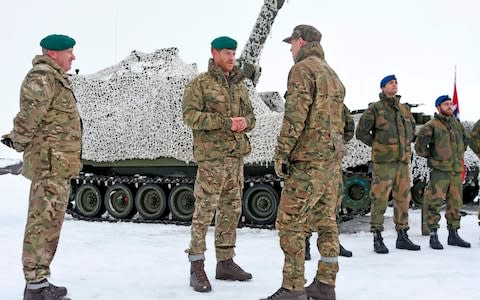 Duke of Sussex speaks with British and Norwegian troops  - Credit: AFP