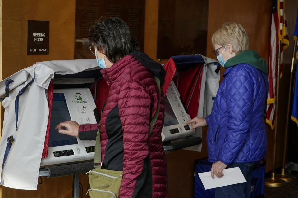 FILE - Residents cast their votes at the Warner Park Community Recreation Center on the first day of early voting Tuesday, March 21, 2023, in Madison, Wis. (AP Photo/Morry Gash, file)