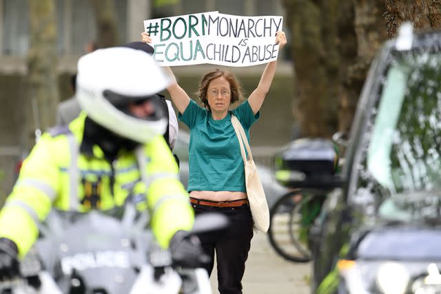 <p>Karwai Tang/WireImage</p> Protestor during Kate Middleton's visit to Foundling Museum
