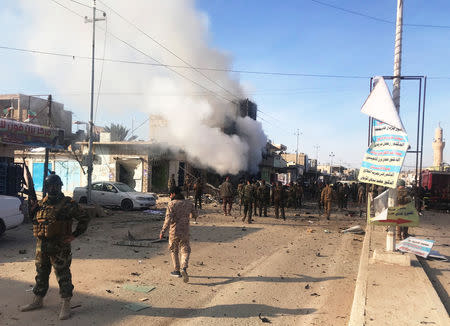 Smoke rises after a car bomb exploded in Iraqi border town of al-Qaim, Iraq January 11, 2019. REUTERS/Stringer