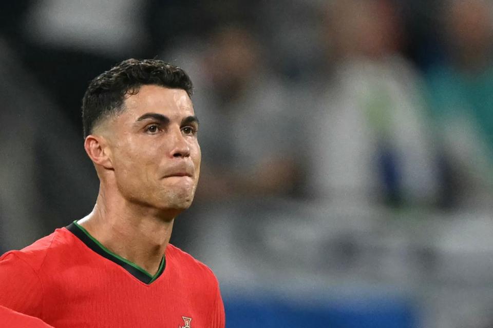 Cristiano Ronaldo shed tears after missing a penalty kick in the round of 16  (AFP via Getty Images)