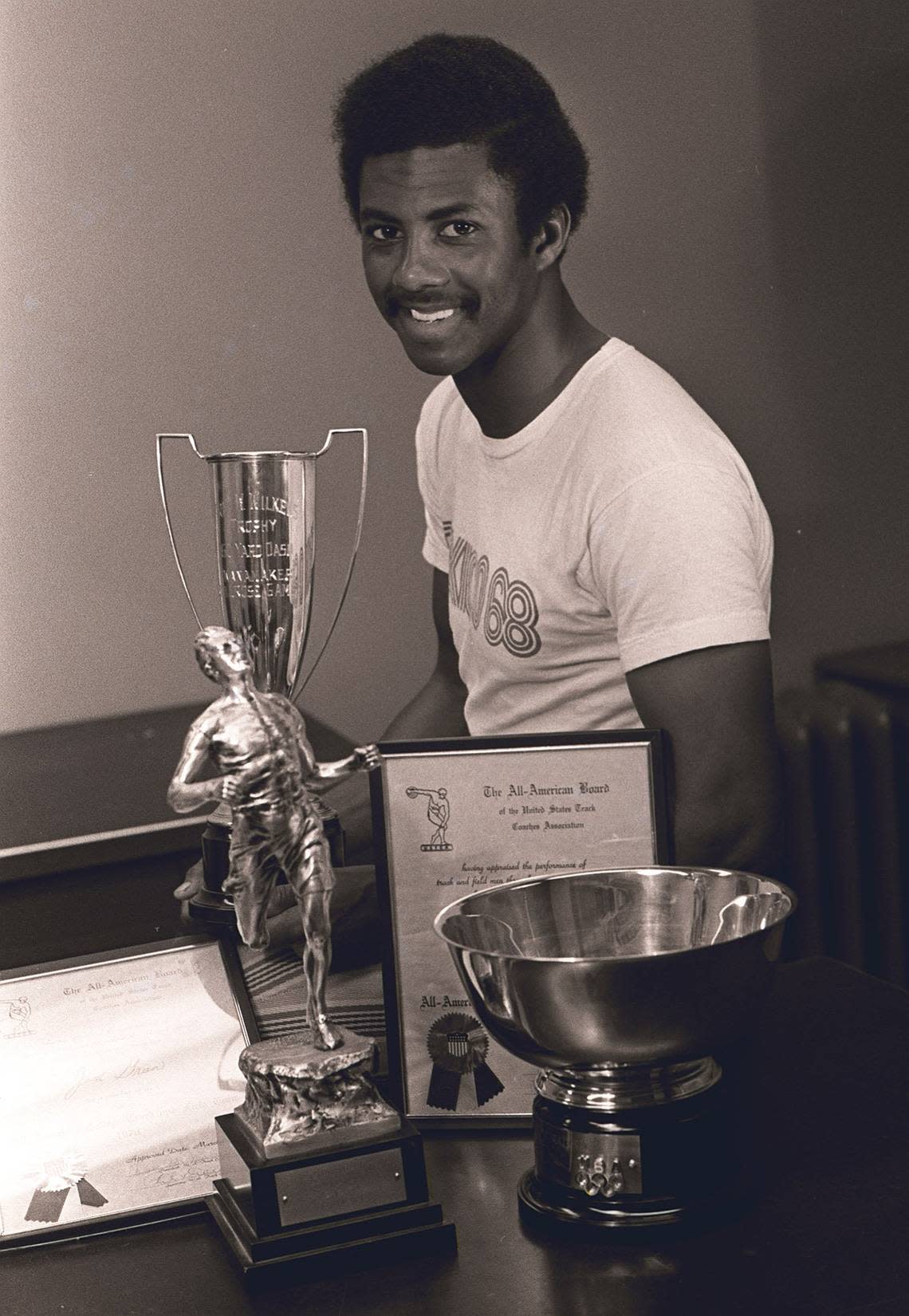 Kentucky All-America sprinter Jim Green poses in 1971 with a few of the trophies he garnered in a career that included three world records.