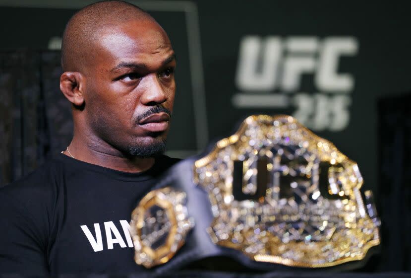FILE - In this Jan. 31, 2019, file photo, light heavyweight champion Jon Jones attends a news conference for the UFC 235 mixed martial arts event in Las Vegas. Former mixed martial arts champion Jones was jailed in Las Vegas early Friday, Sept. 24, 2021, after a predawn incident at Caesars Palace that police said led to his arrest on charges of domestic battery and felony damaging a vehicle. (AP Photo/John Locher, File)