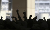 <p>Muslim pilgrims cast stones at three huge stone pillars in the symbolic stoning of the devil, outside the holy city of Mecca, Saudi Arabia, Saturday, Sept. 2, 2017. (Photo: Khalil Hamra/AP) </p>