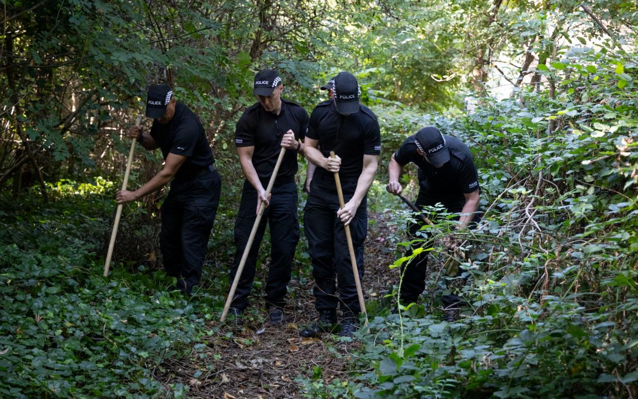 Officers conduct a search off Calder Road in Edinburgh on Sept 4