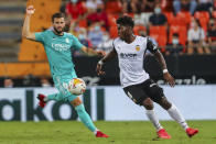 Valencia's Yunus Musah, right, vies for the ball with Real Madrid's Nacho during a Spanish La Liga soccer match between Valencia and Real Madrid at the Mestalla stadium in Valencia, Spain, Sunday, Sept. 19, 2021. (AP Photo/Alberto Saiz)