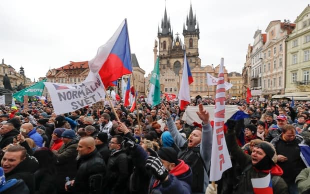 Thousands of demonstrators take part in a protest against the government's restrictive measures to curb the spread of COVID-19, in the capital of Prague on Jan. 10.