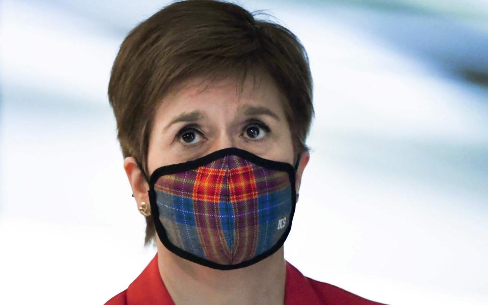 Scotland's First Minister Nicola Sturgeon wearing a face mask or covering due to the COVID-19 pandemic -  ANDY BUCHANAN/AFP