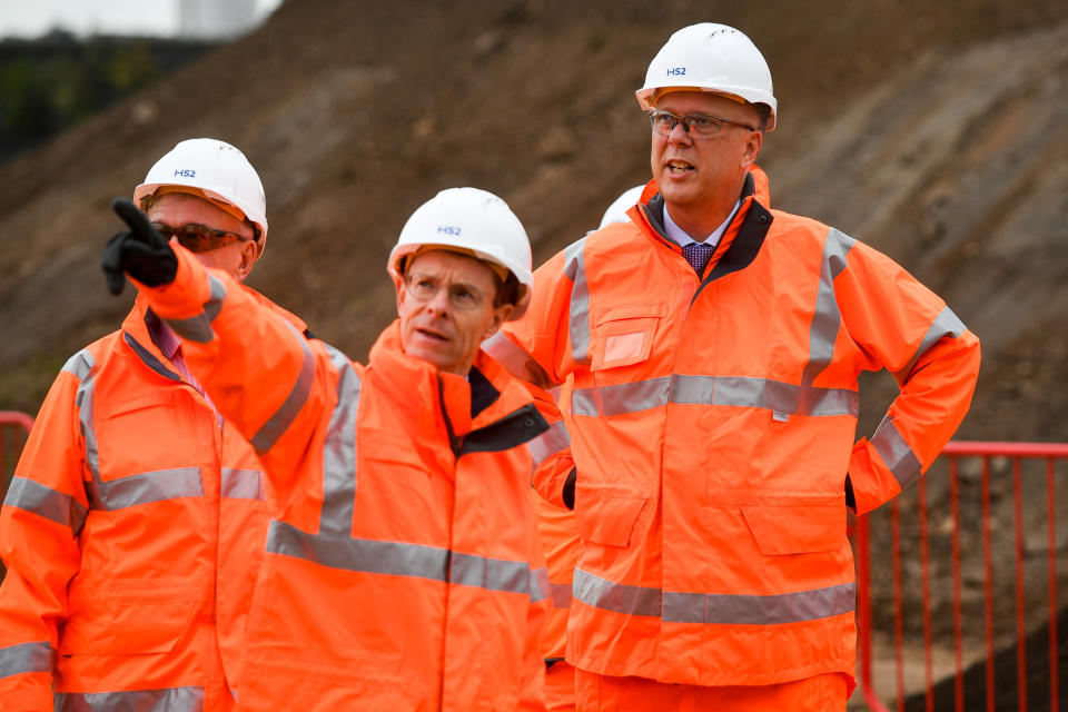 Leader of the House of Commons and Secretary of State for Transport, Chris Grayling (right) meets with construction workers at the Old Curzon Street station site, Birmingham, where work is underway to build the HS2 terminal.