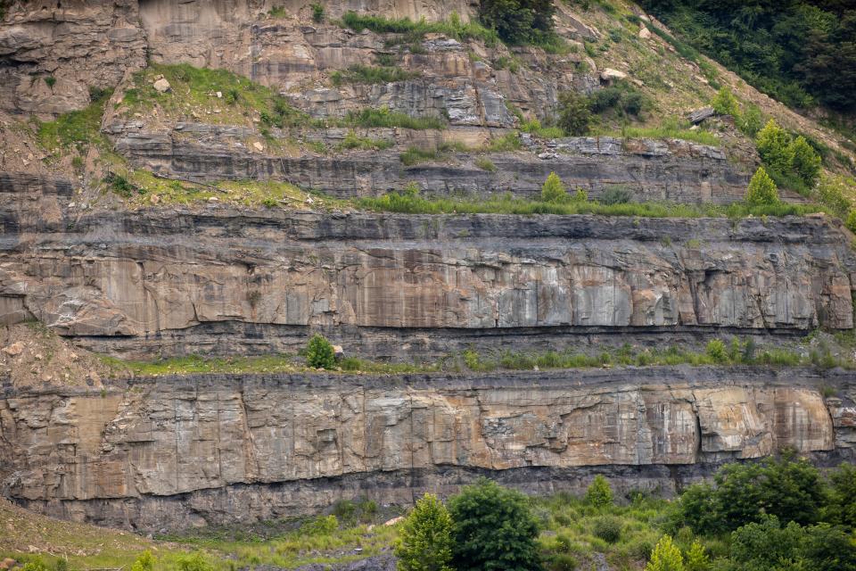 A close view of a high wall over a few hundred feet tall on the strip mined property of the Neece family in Floyd County, Kentucky. July 15, 2021