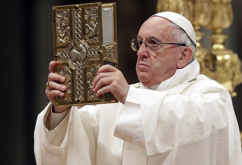 Pope Francis presides over a solemn Easter vigil ceremony in St. Peter's Basilica at the Vatican, Saturday, April 15, 2017. (AP Photo/Andrew Medichini)