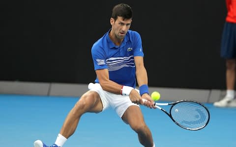 Serbia's Novak Djokovic makes a backhand return to France's Lucas Pouille during their semifinal at the Australian Open tennis championships in Melbourne, Australia, Friday, Jan. 25, 2019 - Credit: AP