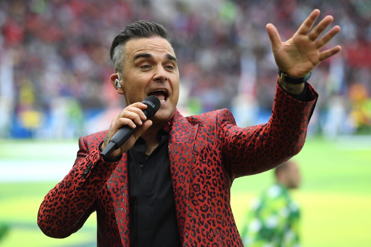 English musician Robbie Williams performs during the Russia World Cup opening ceremony before the tournament's first match between Russia and Saudi Arabia on June 14, 2018 at Moscows Luzhniki Stadium. (Photo by Patrik STOLLARZ / AFP)        (Photo credit should read PATRIK STOLLARZ/AFP via Getty Images)