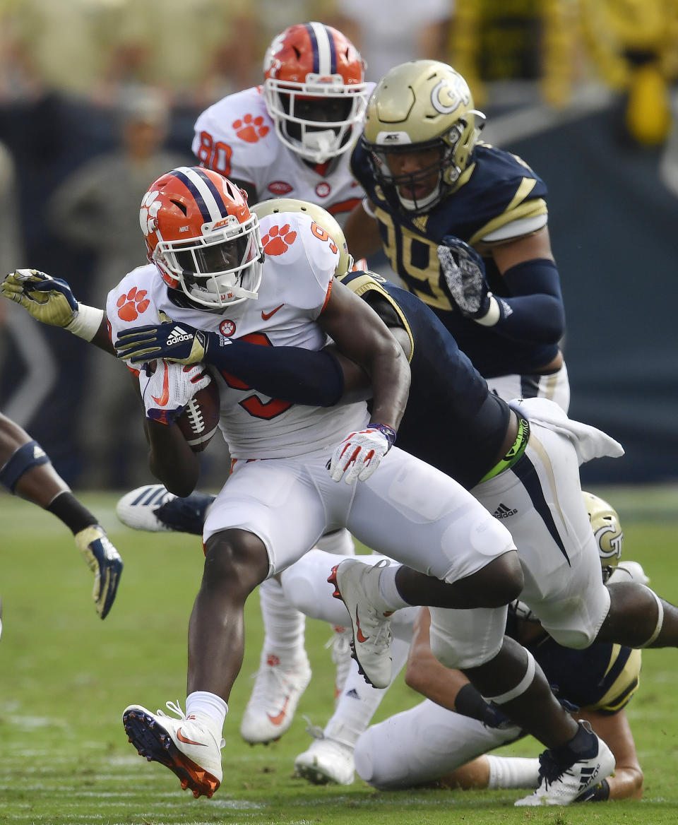 Clemson running back Travis Etienne (9) runs against Georgia Tech during the first half of an NCAA college football game, Saturday, Sept. 22, 2018, in Atlanta. (AP Photo/Mike Stewart)