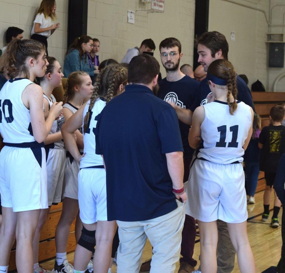 Seven Oaks girls' basketball head coach Matt Box gathers his team during a break in the action this season.
