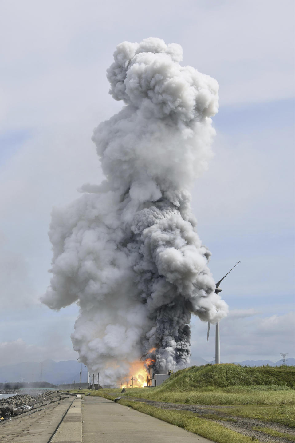 Smoke rises as an engine for an Epsilon S rocket exploded during a test at the Japan Aerospace Exploration Agency's testing site in Noshiro, Akita Prefecture, northeastern Japan, Friday, July 14, 2023. (Kyodo News via AP)