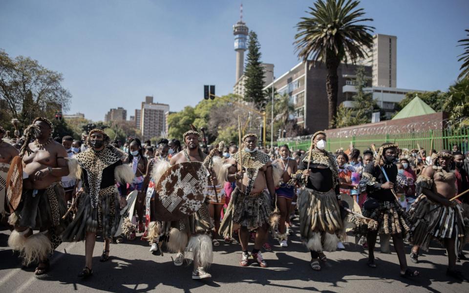 More than 200 Zulu traditionally dressed people parade through the streets in Johannesburg - LUCA SOLA/AFP via Getty Images