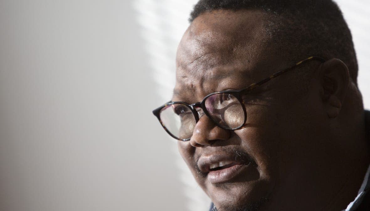 FILE – Exiled Tanzanian opposition leader Tundu Lissu gives an interview to The Associated Press in Tienen, Belgium on March 19, 2021. Lissu has arrived home Wednesday, Jan. 25, 2023 after five years in exile, three weeks after the country’s president Samia Suluhu Hassan lifted a ban on opposition rallies. (AP Photo/Virginia Mayo, File)