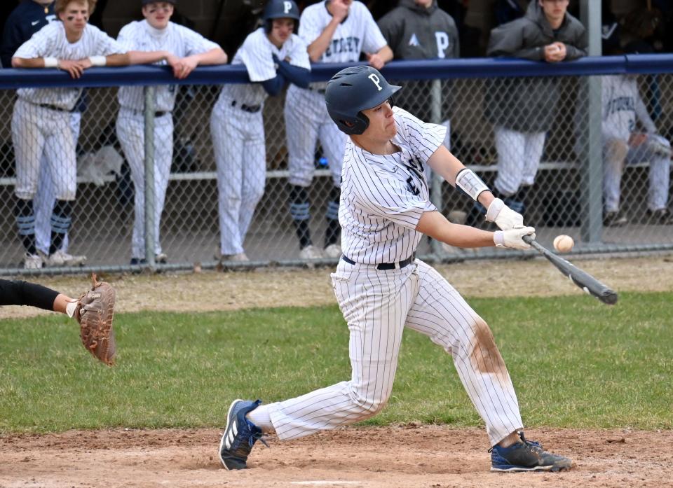 Petoskey's Ely Pethers swings into a pitch with contact during the opening game against Ogemaw Heights Thursday at Turcott Field.