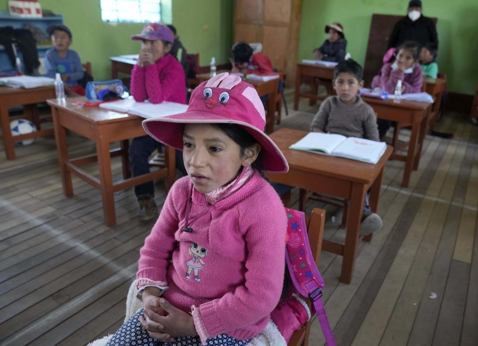 Students attend Quechua Indigenous language class at a public primary school in Licapa, Peru, Wednesday, Sept. 1, 2021. The school began to teach Quechua for the first time in April, when bilingual teacher Alicia Cisneros was transferred to the village. (AP Photo/Martin Mejia)