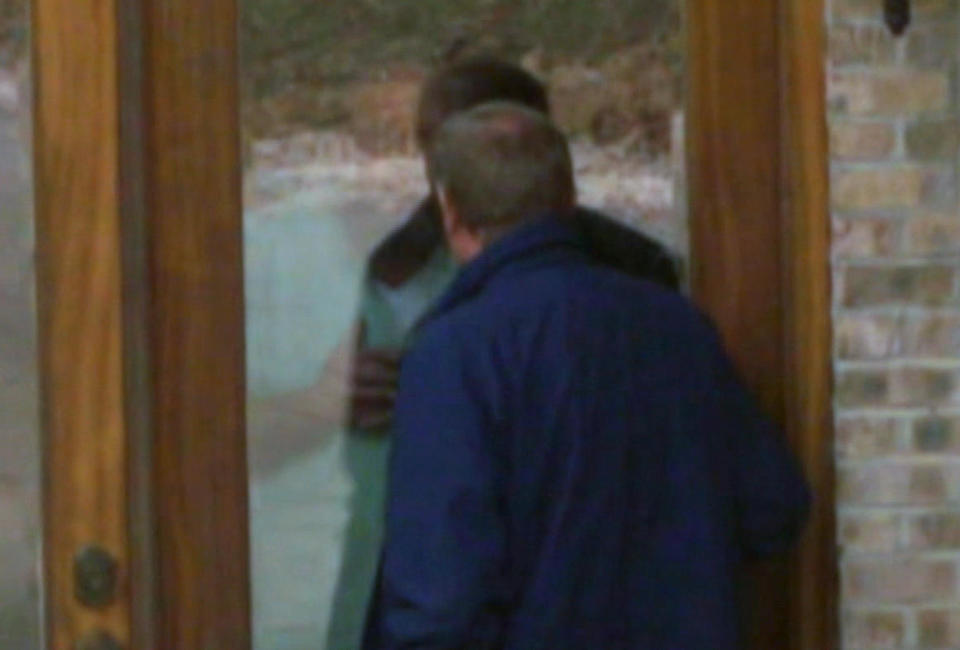 Peter Van Sant talks with Mike Warren through Warren's front door. / Credit: CBS News