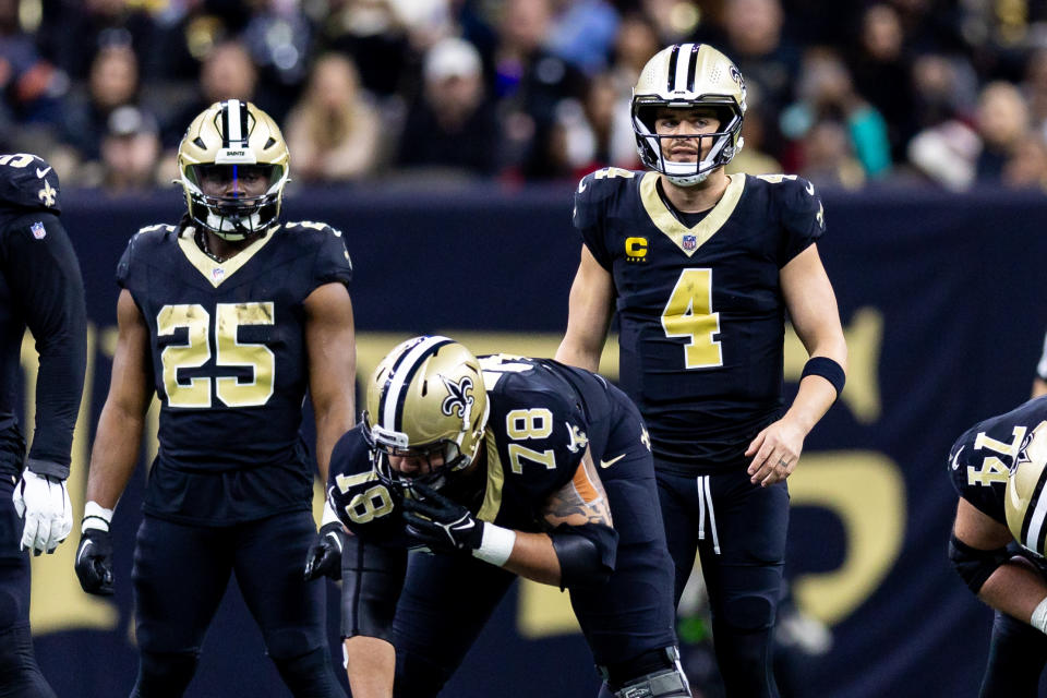 Jan 7, 2024; New Orleans, Louisiana, USA; New Orleans Saints quarterback Derek Carr (4) looks over the Atlanta Falcons defense during the first half at Caesars Superdome. Mandatory Credit: Stephen Lew-USA TODAY Sports