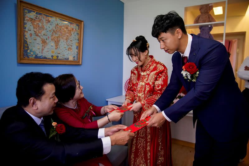The Wider Image: Coronavirus dampens celebrations in China's wedding gown city
