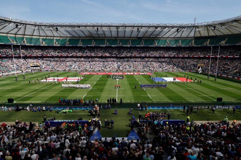 The two teams line up for the national anthems in front of a world record crowd for a women’s rugby match during the Women’s Six Nations 2023 match between England and France at Twickenham Stadium in April 2023.