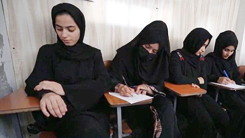 Teenage Afghan girls attend class at an unofficial, private school in Kabul, Afghanistan, in August 2022, a year after the Taliban regained control of the country.  / Credit: CBS News