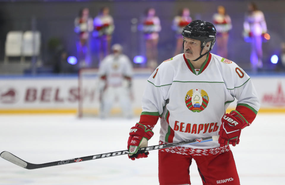 FILE In this file pool photo taken on Saturday, April 4, 2020, Belarusian President Alexander Lukashenko takes part in a hockey match during Republican amateur competitions in Minsk, Belarus. Belarus’ authoritarian President Alexander Lukashenko faces a perfect storm as he seeks a sixth term in the election held Sunday, Aug. 9, 2020 after 26 years in office. Mounting public discontent over the worsening economy and his government’s bungled handling of the coronavirus pandemic has fueled the largest opposition rallies since the Soviet collapse. (Andrei Pokumeiko/BelTA Pool Photo via AP, File)