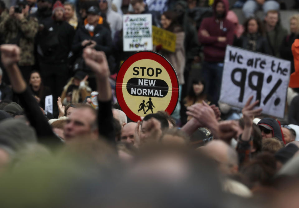 People take part in a 'We Do Not Consent' rally at Trafalgar Square, organised by Stop New Normal, to protest against coronavirus restrictions, in London, Saturday, Sept. 26, 2020. (AP Photo/Frank Augstein)