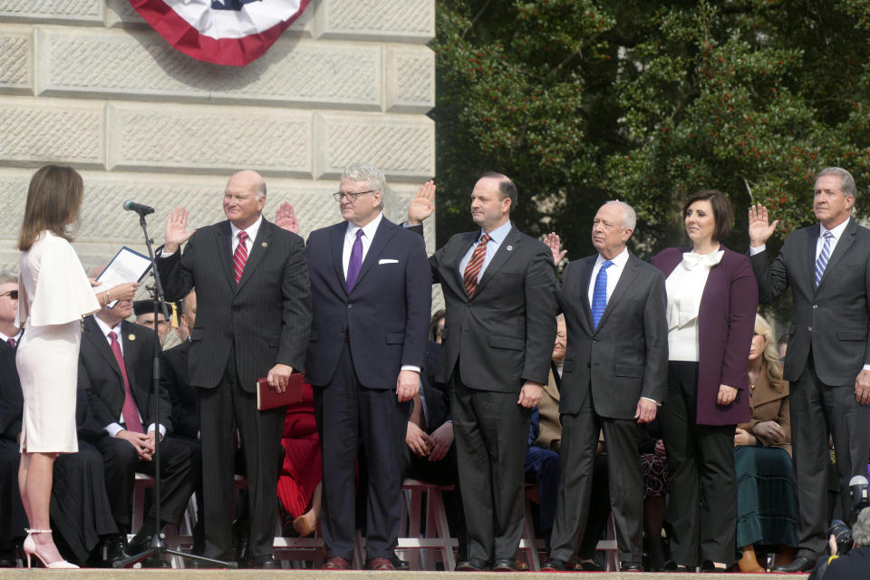 South Carolina Lt. Gov. Pamela Evette, left, administers the oath of office to state officers, from left, Secretary of State Mark Hammond, Treasurer Curtis Loftis, Attorney General Alan Wilson, Comptroller General Richard Eckstrom, Education Superintendent Ellen Weaver and Agriculture Secretary Hugh Weathers, at inaugural ceremonies on Wednesday, Jan. 11, 2023, in Columbia, S.C. (AP Photo/Meg Kinnard)