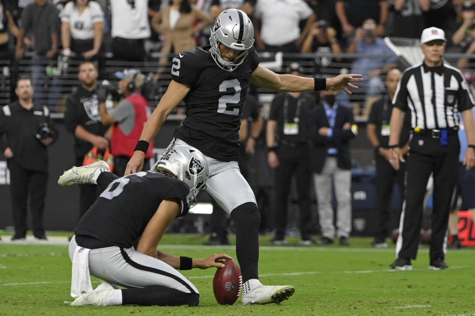 Las Vegas Raiders kicker Daniel Carlson (2) kicks a filed goal against the Miami Dolphins with seconds left during overtime of an NFL football game, Sunday, Sept. 26, 2021, in Las Vegas. (AP Photo/David Becker)