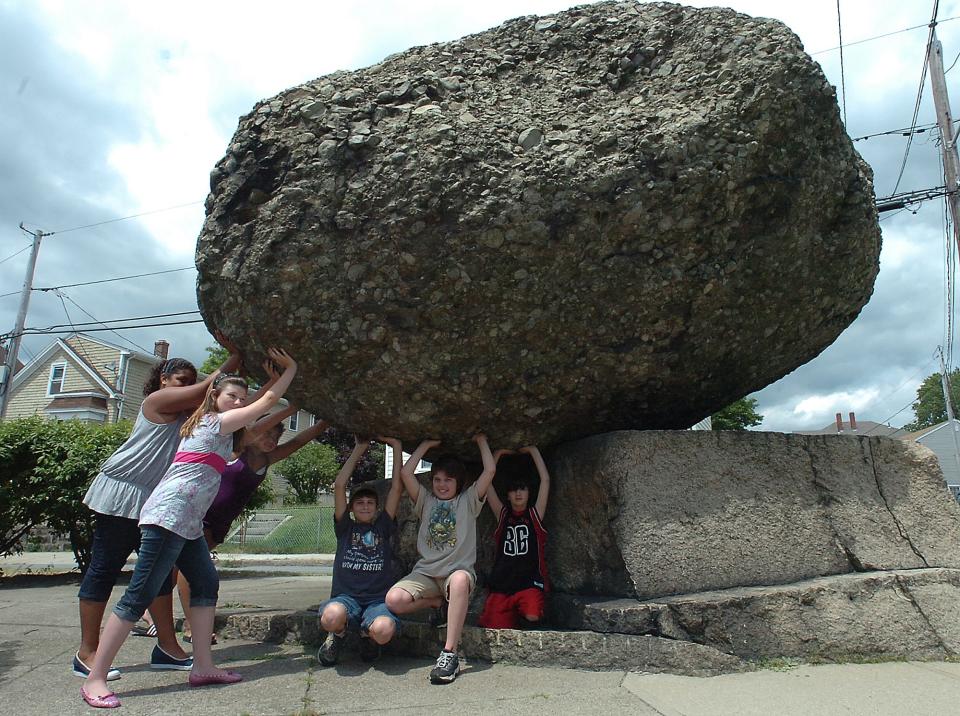 Kids attempt to push the Rolling Rock in Fall River, in this undated file photo.