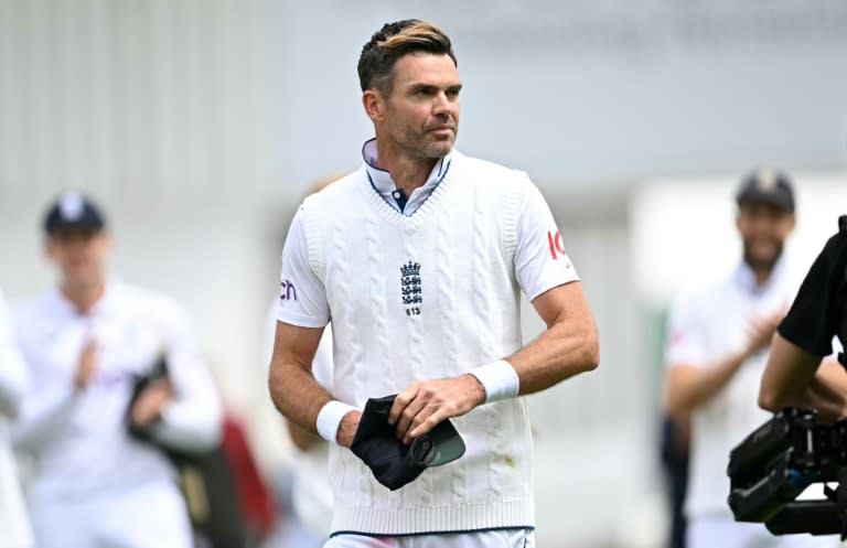 Bowing out: England's James Anderson walks off the field for the last time in Test cricket following an innings and 114-run win over the West Indies at Lord's (Paul ELLIS)