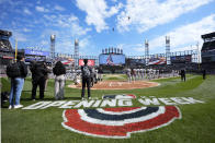 Two U.S. Army helicopters fly over Guaranteed Rate Field during the Chicago White Sox's home opener baseball game against the Detroit Tigers Thursday, March 28, 2024, in Chicago. (AP Photo/Charles Rex Arbogast)