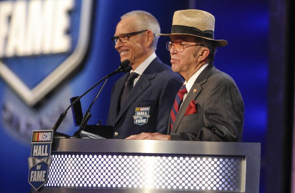 NASCAR team owner Jack Roush, right, presents the Hall of Fame ring to Mark Martin during the NASCAR Hall of Fame induction ceremony in Charlotte, N.C., Friday, Jan. 20, 2017. (AP Photo/Mike McCarn)
