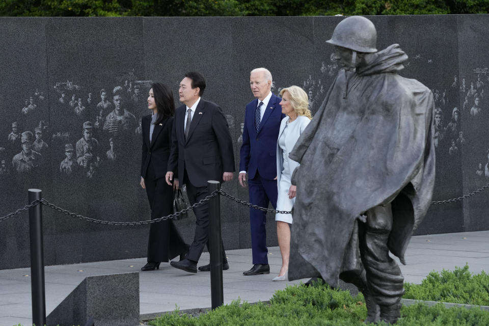 President Joe Biden, first lady Jill Biden, South Korea's President Yoon Suk Yeol and his wife Kim Keon Hee visit the Korean War Veterans Memorial in Washington, Tuesday, April 25, 2023. (AP Photo/Susan Walsh)