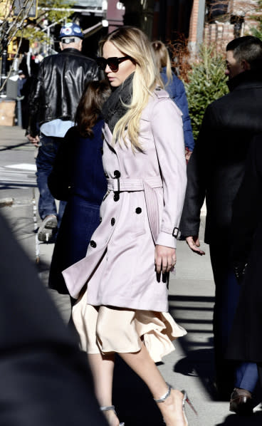 Jennifer Lawrence out and about in New York City wearing a Burberry cashmere trench coat.
