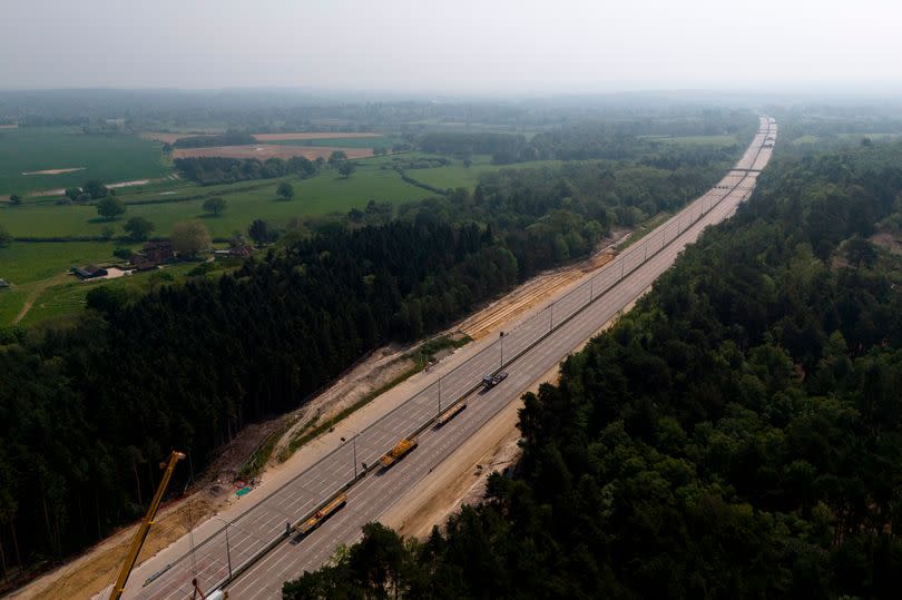 Engineering works taking place at the A3 Wisley interchange at Junction 10 of the M25 as concrete beams for a new bridge are installed