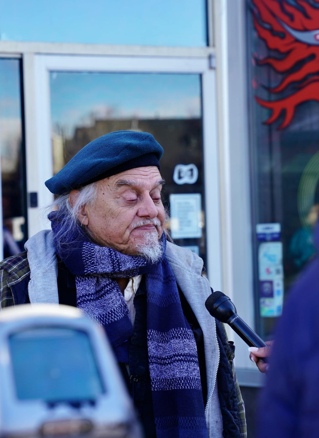 Alfredo Cardenas speaks to reporters outside his daughter's tattoo shop in Denver on Dec. 28, 2021. A suspect shot and killed four people and injured three in a shooting spree Monday night that ended in a gunfight with police, where the suspect was killed, authorities say.