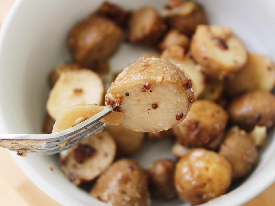 slow cooker potato salad in a white bowl