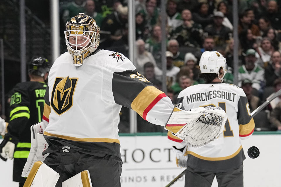 Vegas Golden Knights goaltender Adin Hill releases the puck after making a save against the Dallas Stars during the first period of an NHL hockey game Wednesday, Nov. 22, 2023, in Dallas. (AP Photo/Tony Gutierrez)